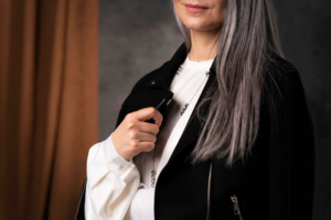 a woman wearing a black jacket