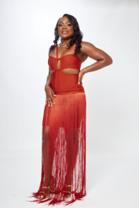 Woman posing in a red evening gown